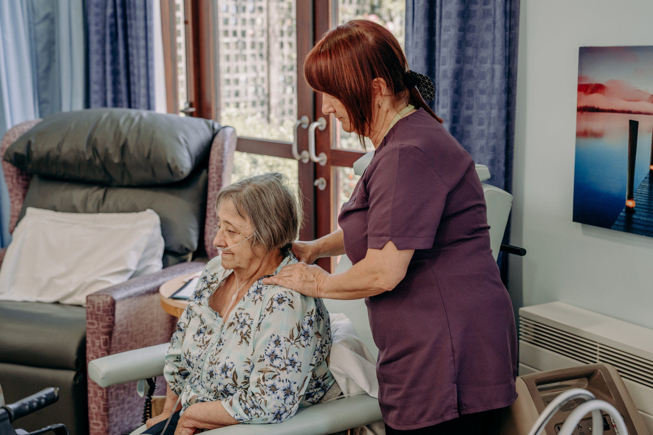 Complementary therapist giving patient a neck massage