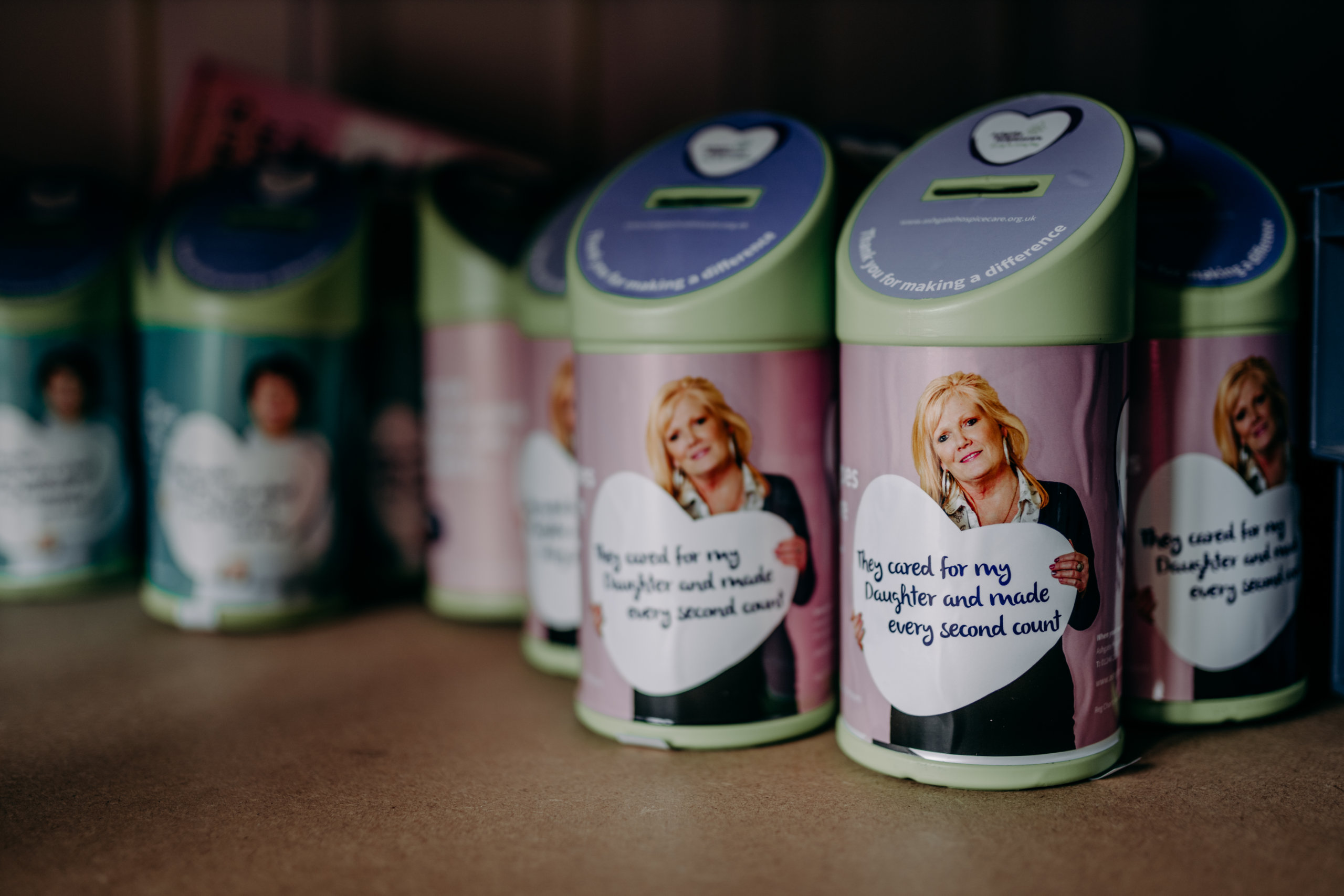 Ashgate Hospice collection tins on a shelf
