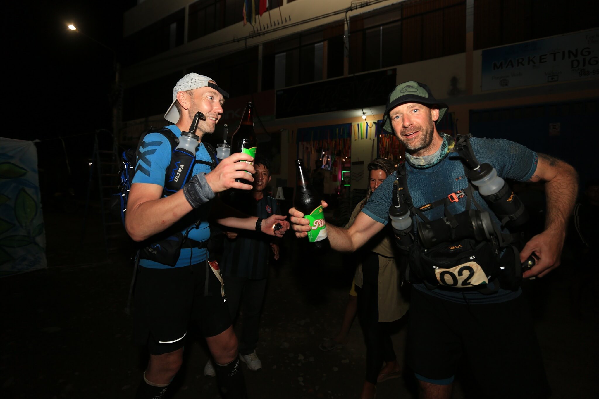 two men celebrating with beers