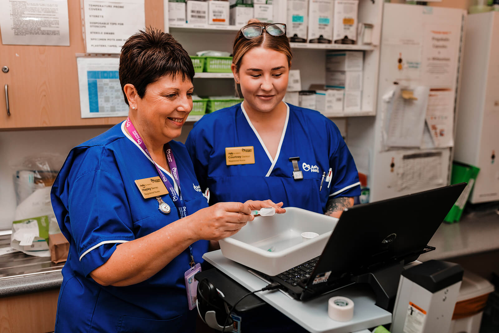 Nurses looking over notes.