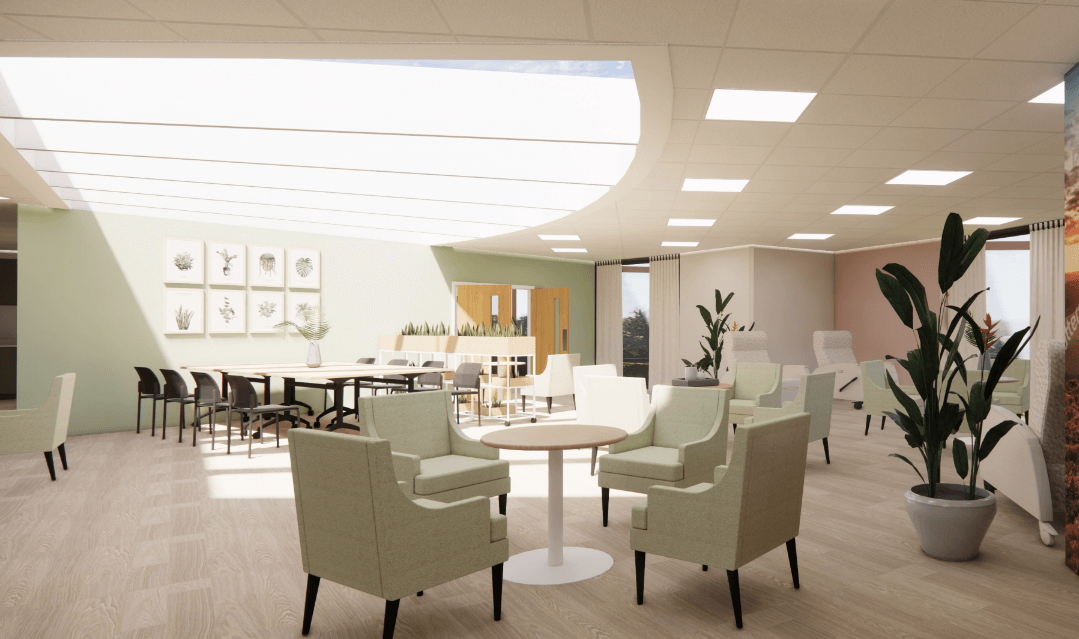 Graphic showing how the Day Room will look. A bright ceiling light, with light sage chairs in the foreground and darker chairs and desks in the background.