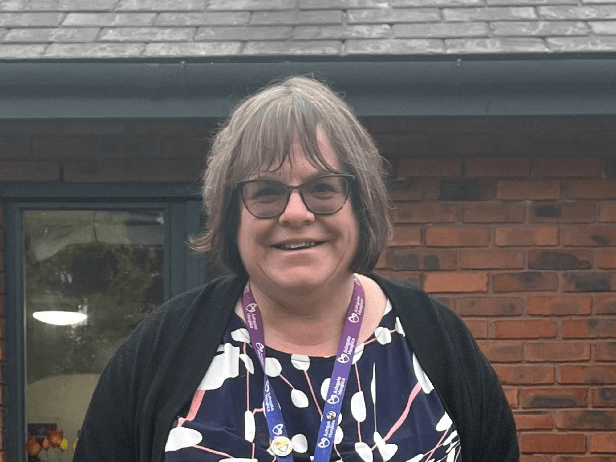 Siobhan Hoyes stood outside in a courtyard at Ashgate Hospice.