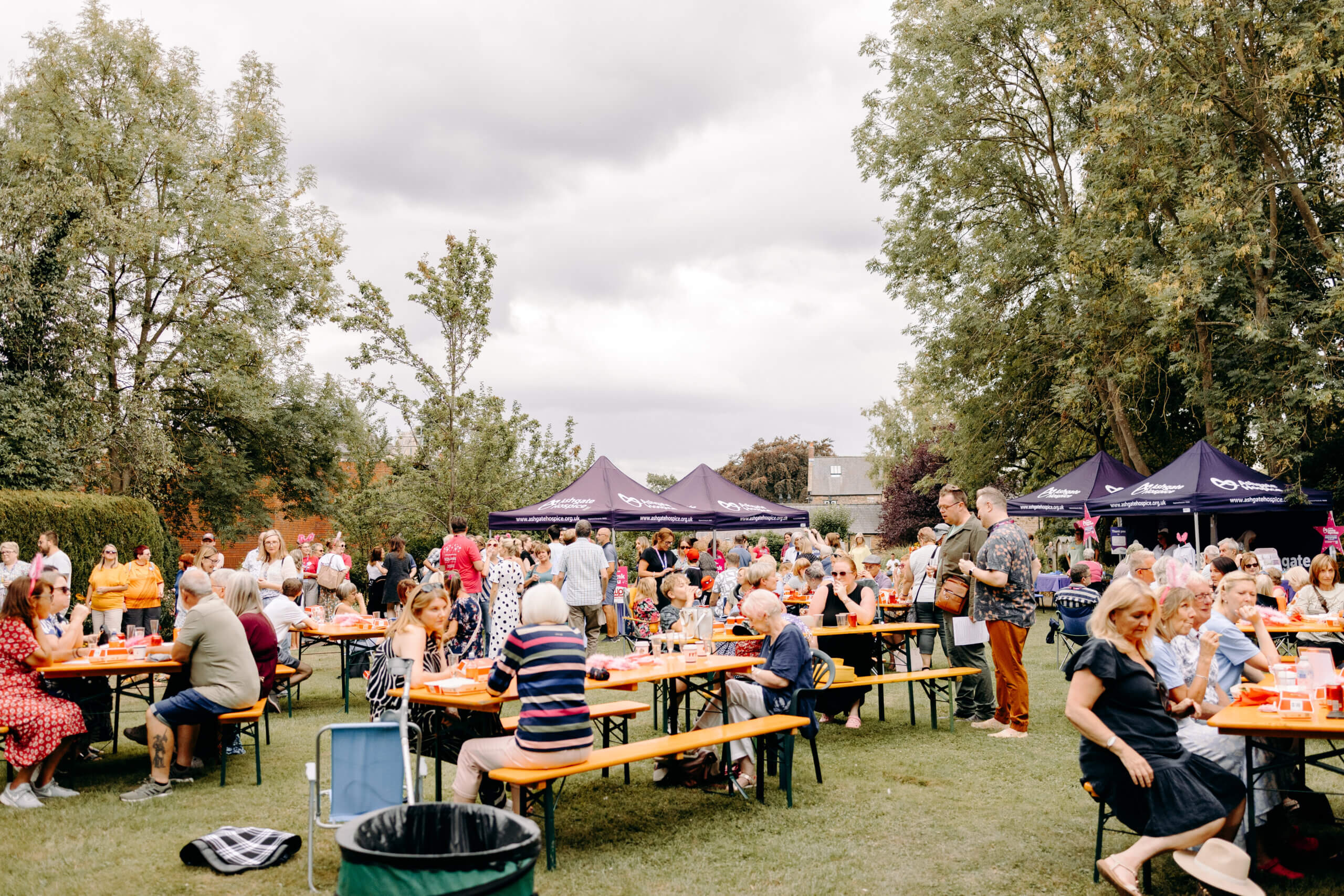 People gathered on benches at the Summer Sizzle.